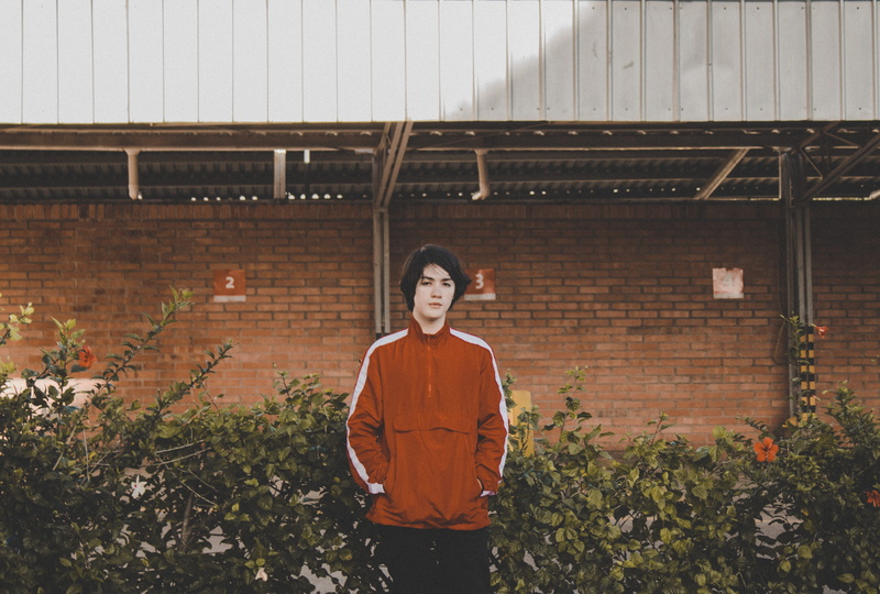 red, human, pants, architecture, front, nature, long sleeve, adult, garden, planter, three quarter length, front view, lifestyles, man, porch, jar, standing