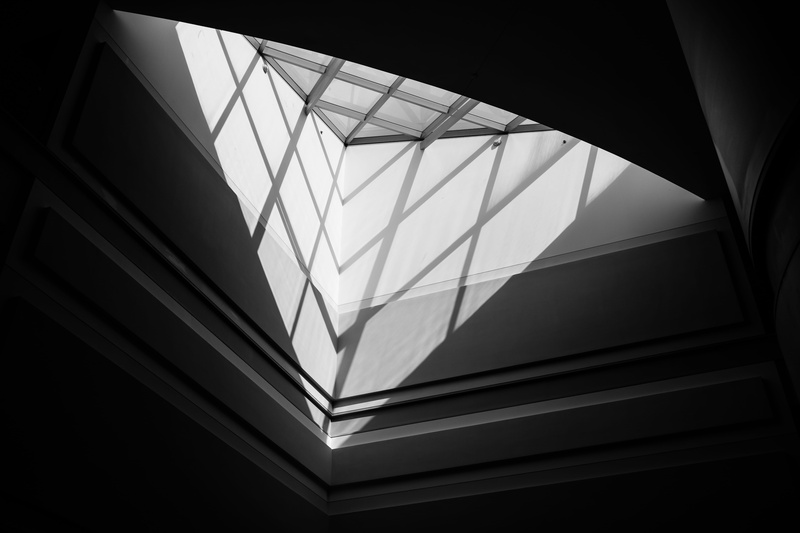 transparent, indoors, low angle view, glass - material, architecture, skylight, ceiling, nature, no people, geometry, light, building, pattern, built structure