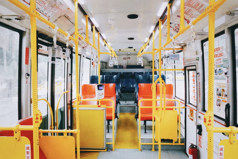 seat, train, terminal, indoor play area, tour bus, absence, vehicle interior, chair, furniture, mode of transportation, indoors, automobile, school bus
