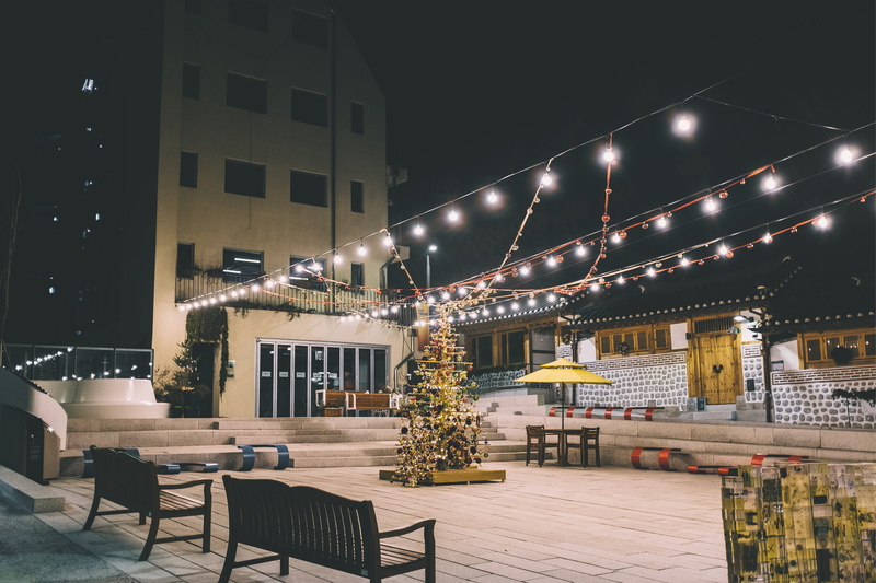 illuminated, christmas tree, ornament, potted plant, sky, porch, transportation, nature, city, built structure, tree, vase, plant, handrail, near, decoration