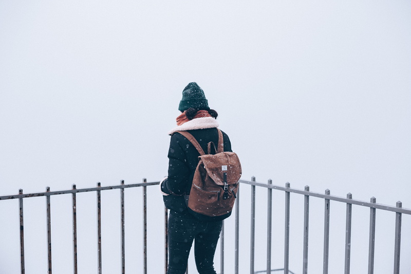 minimalism, snowing, clear sky, fence, overcoat, boundary, cold temperature, railling, barrier, apparel, banister, railing, cap, scandinavian, hood - clothing