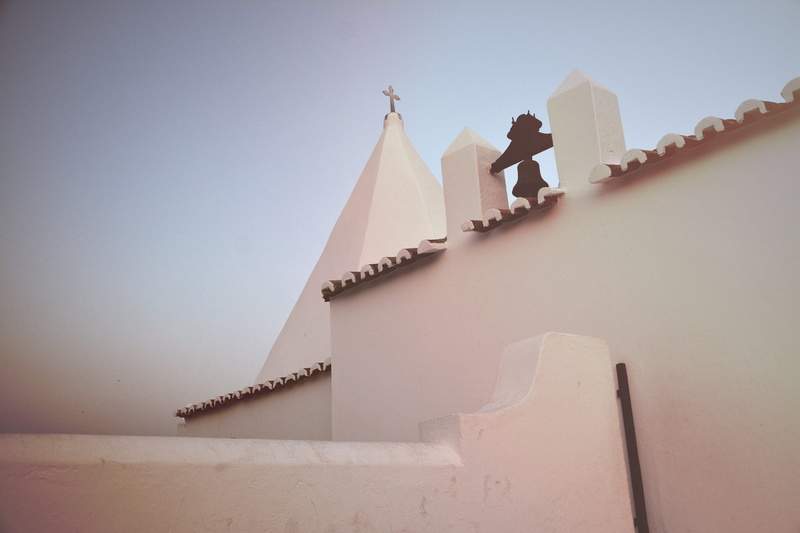roof, sky, sunlight, outdoors, spire, building, day, architecture, wall, cross, dune, place of worship, belief, wall - building feature, building exterior