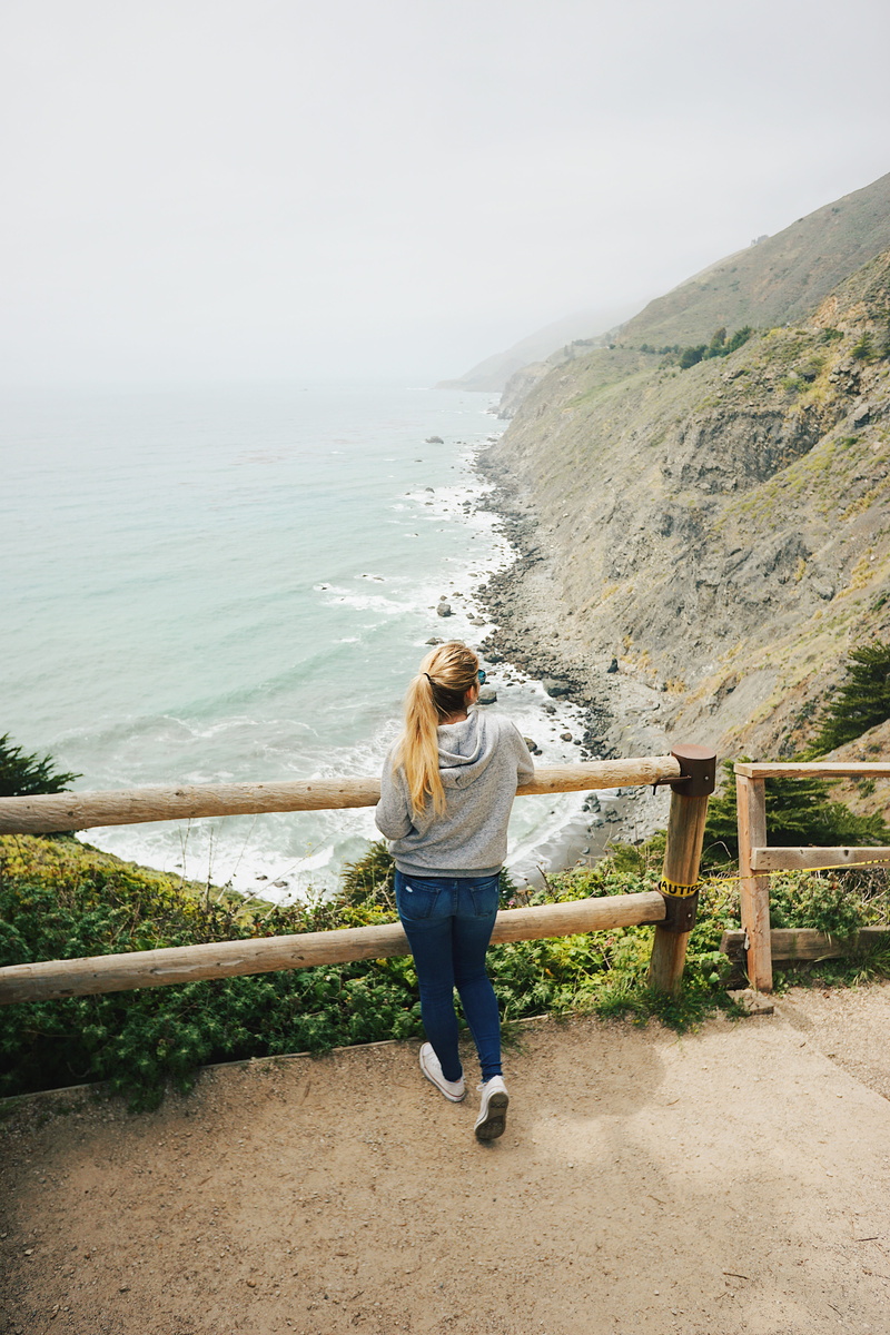 lifestyles, full length, blonde, waves, rear view, jeans, sky, standing, rocks, coastline, shoreline, beauty in nature, casual clothing, outdoors, hair