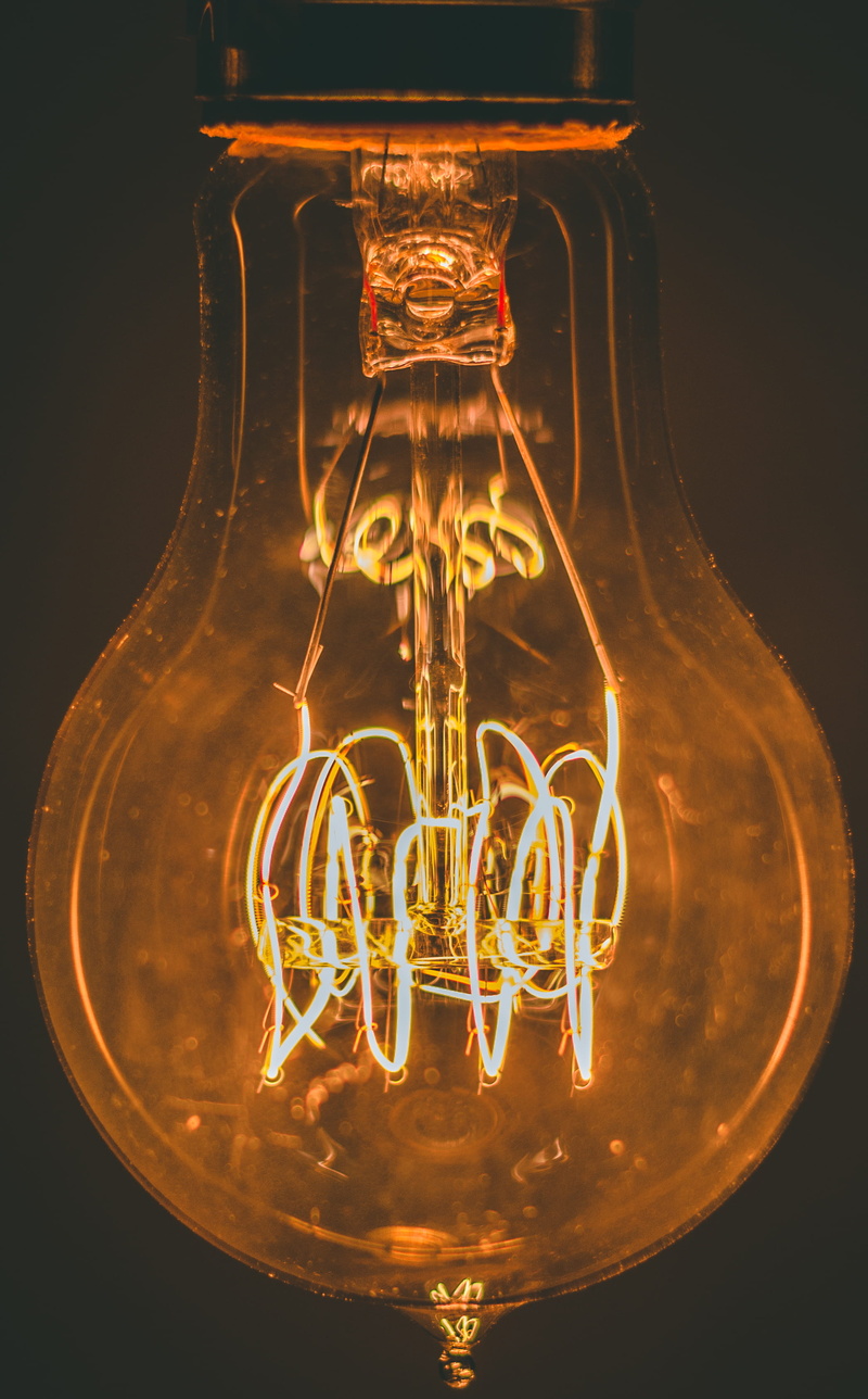close-up, electric lamp, black background, single object, orange color, luminosity, studio shot, filament, lightbulbmoment, inspire, no people, electric light