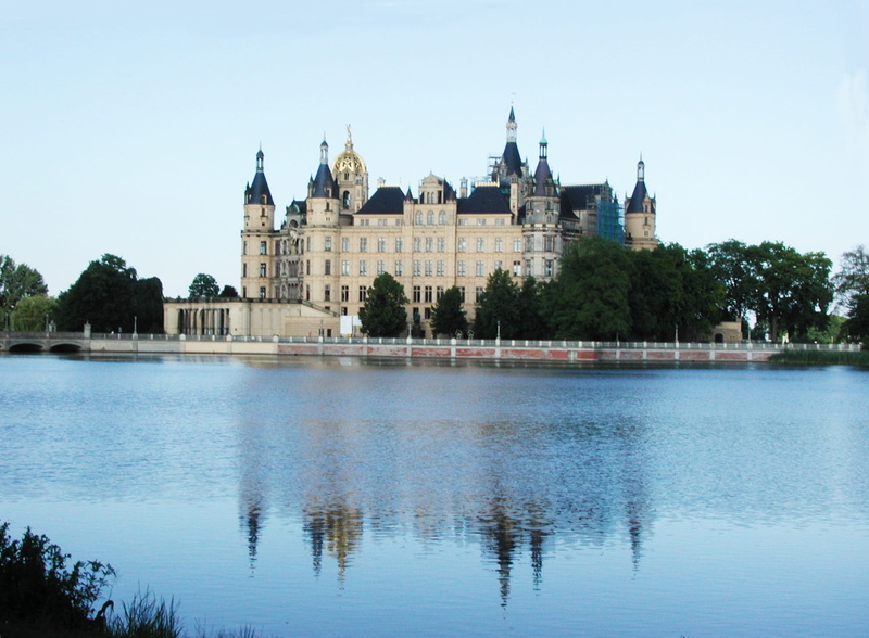 plant, history, clear sky, schweriner see, water, no people, reflection, the past, schwerin castle, travel, outdoors, built structure, schwerin, lake, building exterior