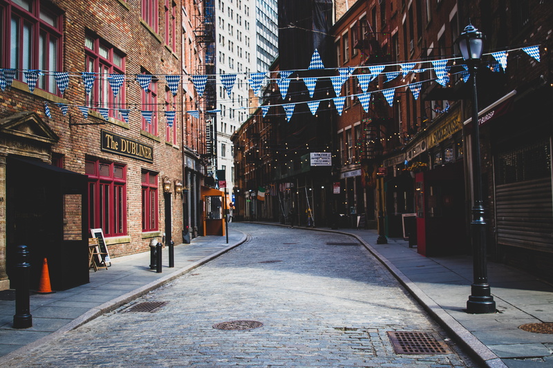 outdoors, city, communication, day, transportation, incidental people, buildings, person, sign, street, walkway, across, urban, footpath, the way forward
