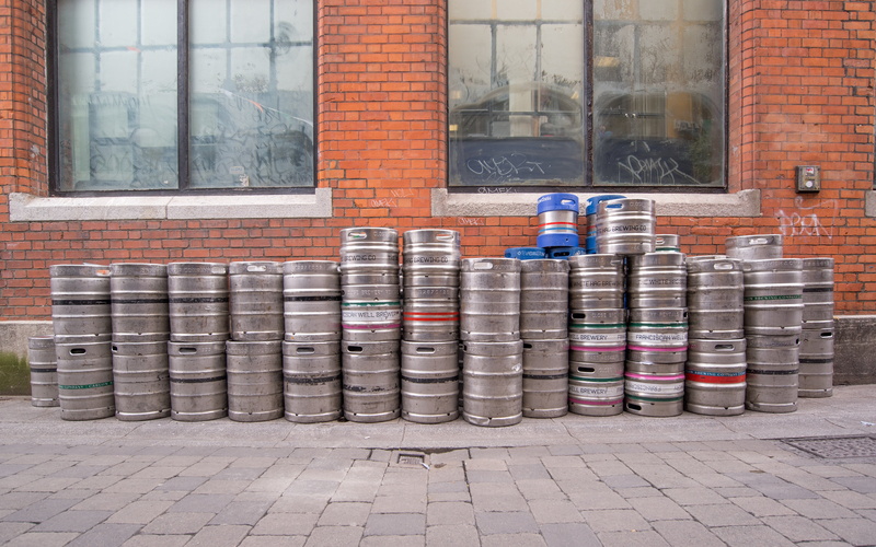 built structure, mug, architecture, barrels, window, pub, footpath, day, sidewalk, alcohol, glass - material, wall, no people, brick wall, guinness, beer