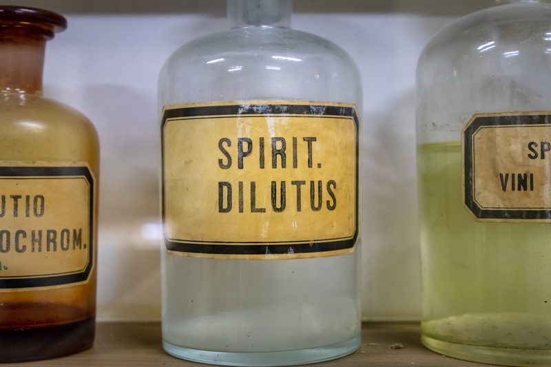alcohol, focus on foreground, bottle, cylinder, cosmetics, information, jar, beverage, shaker, syrup, bowl, label, glass - material, text, food and drink