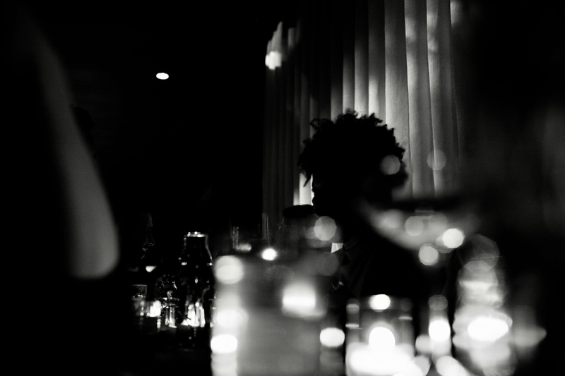 liquor, drink, bar counter, alcohol, crystal, beverage, indoors, 5K, unrecognizable person, selective focus, one person, real people, illuminated, incidental people