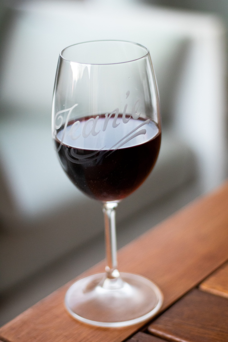 food, drink, stellenbosch wine, wine bottle, indoors, bottle, hardwood, wood - material, alcohol, drinking glass, goblet, still life, beer glass, focus on foreground