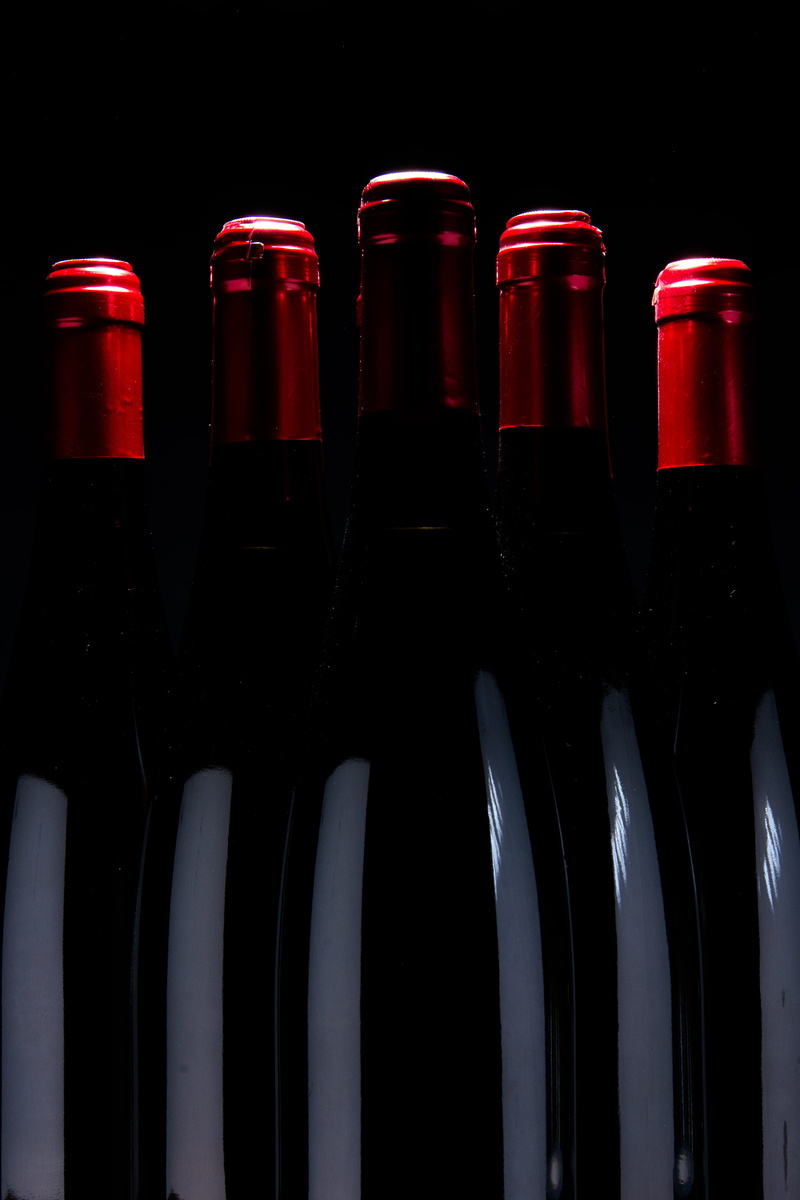 glass, no people, indoors, food and drink, order, liquor, brick, stout, container, five, refreshment, bottle, bottles, red, beer bottle, advertisement