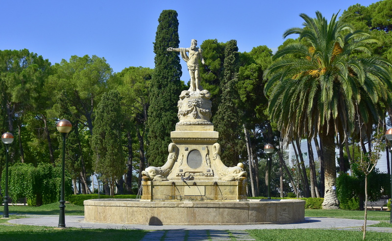 architecture, clear sky, art and craft, monuments, religion, palm tree, plant, male likeness, tropical climate, growth, nature, creativity, representation