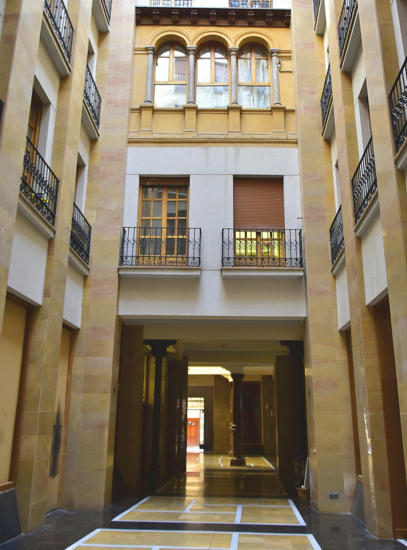 balcony, city, saragossa, architectural column, the past, day, building exterior, low angle view, residential district, illuminated, building, arch, history