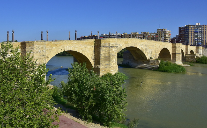 building exterior, urban, monument, day, historical, arched, connection, arch, transportation, clear sky, plant, arch bridge, nature, built structure, river