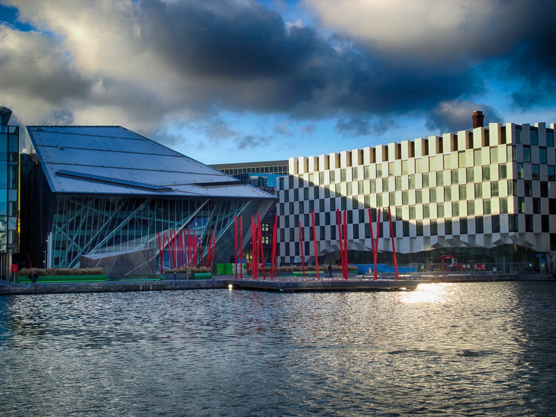 water, grand canal theatre, building exterior, body, 2K, outdoors, river, sky, urban, pier, clouds, reflections, ireland, transportation, canal, day, built structure