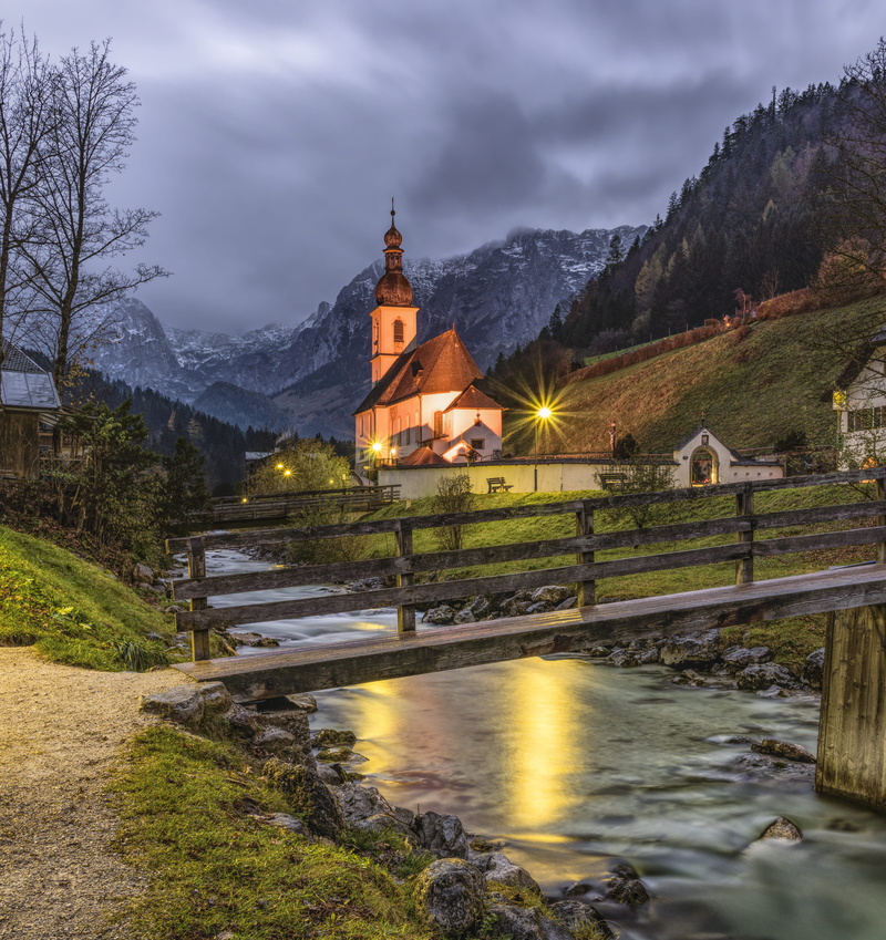 tree, dusk, outdoors, belief, cloud - sky, building, mountain, bridge - man made structure, night, building exterior, plant, town, village, foot, place of worship