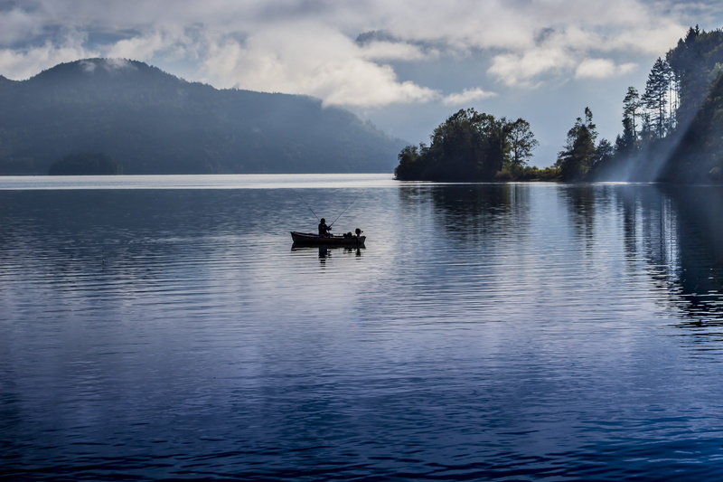 mode of transportation, sky, waters, reflection, rainy weather, nautical vessel, atmospheric, panorama, fish, mountain, outdoors, water reflection, beauty in nature