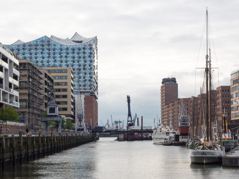 skyscraper, sailboat, sky, crane - construction machinery, places of interest, glass, day, city, Elbe Philharmonic Hall, building, ship, river, machinery