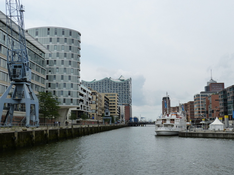 office building exterior, sky, building, transportation, built structure, water, day, building exterior, office, cityscape, passenger craft, nature, elbe philharmonic hall