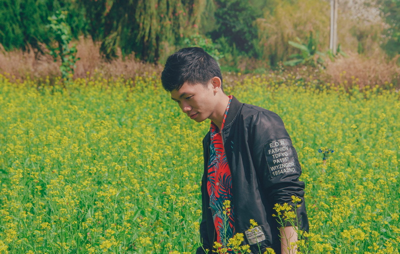 environment, wearing, plant, growth, outdoors, blooming, yellow, photoshoot, three quarter length, flowers, cropland, day, standing, beauty in nature, one person