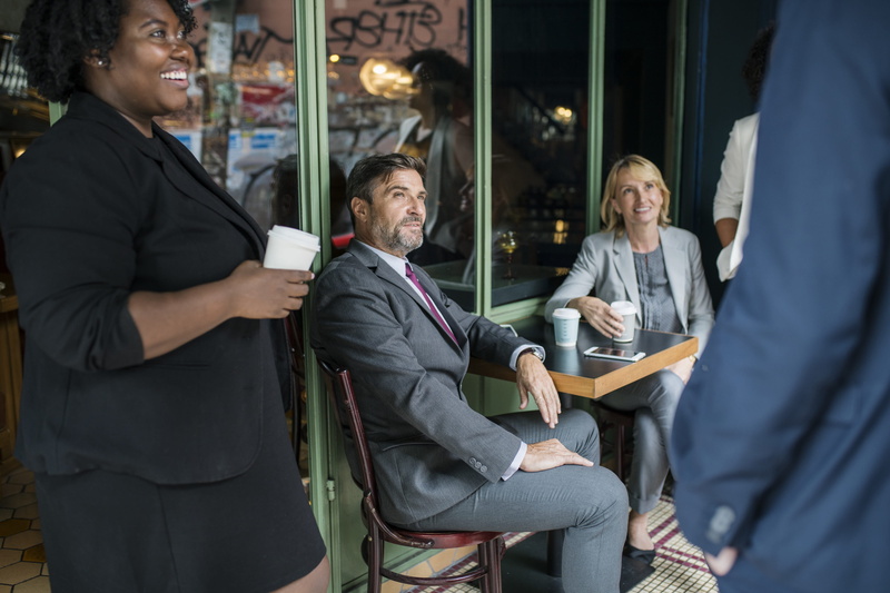 businesswoman, real people, city, business, cafe, group of people, coffee, discussion, communicating, black, architecture, women, corporate business, sitting