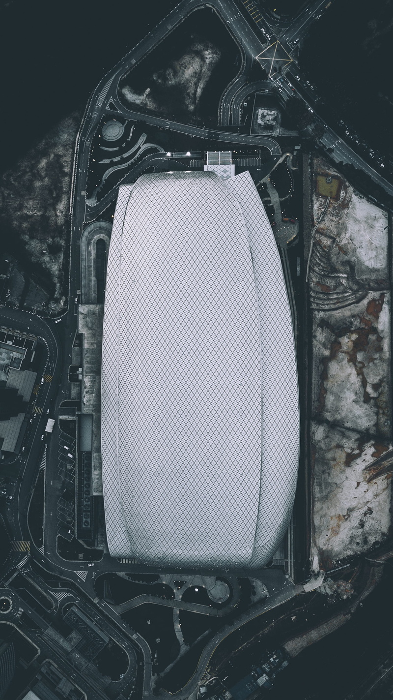 outdoors, urban, photography, motor vehicle, grayscale, modern architecture, photo, engine, looking down, travel, communication, aerial view, background