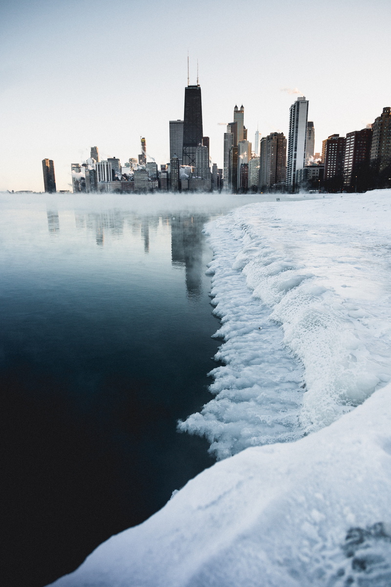 clear sky, cold temperature, sky, sea, reflection, snowy, skyscraper, skyline, city, buildings, cold, winter, modern, season, building exterior, urban skyline