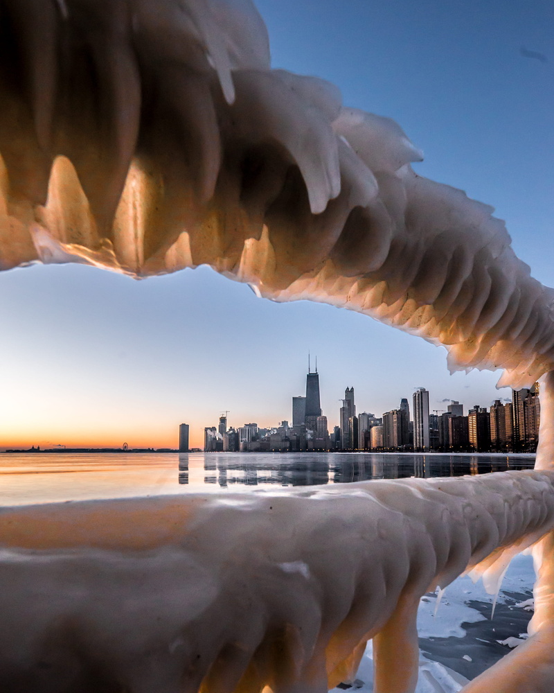 reflection, frosty, skyscraper, cityscape, bird, sea, weather, handrail, scenic, frost, office building exterior, sky, building, travel destinations, financial district