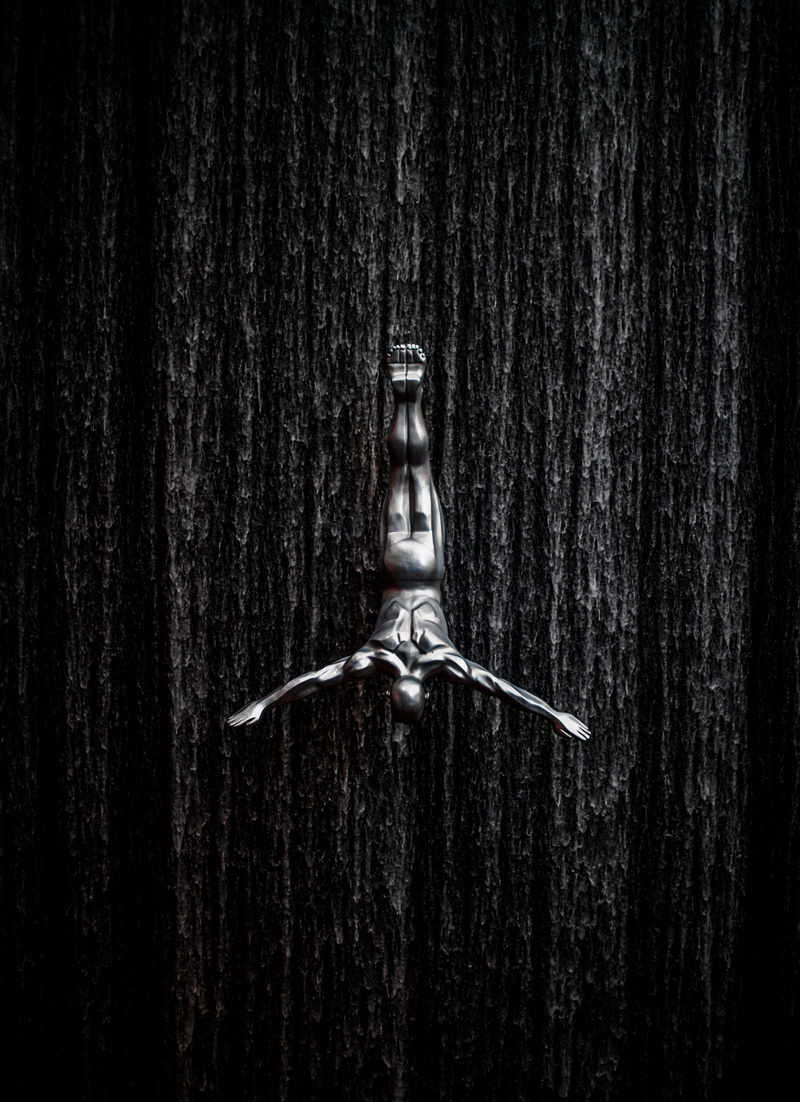 male likeness, full frame, dark, wood - material, going, wide, backgrounds, man, waterfalls, arm, representation, textured, photo, day, diving, nature