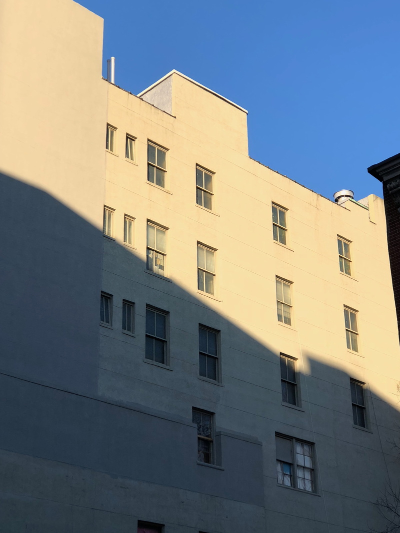 builidng, sky, modern, building, clear sky, window, residential district, sunlight, low angle view, wall - building feature, shadow, building exterior