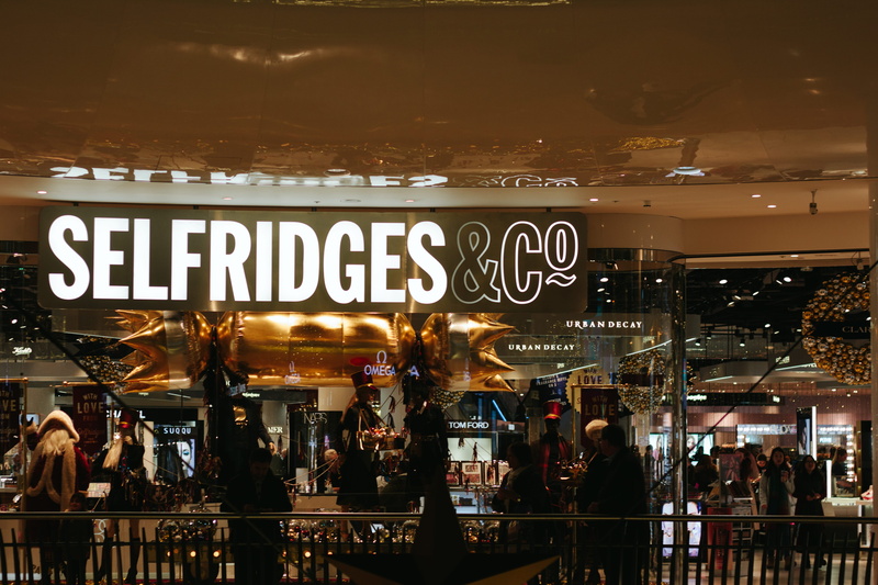 built structure, text, glass - material, store, non-western script, sign, real people, script, bullring, illuminated, city, selfridges, western script