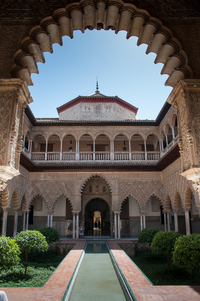 seville, travel, mudejar, building exterior, courtyard, plant, arch, ornate, arcade, history, entrance, architectural column, alcazar, sky, architecture