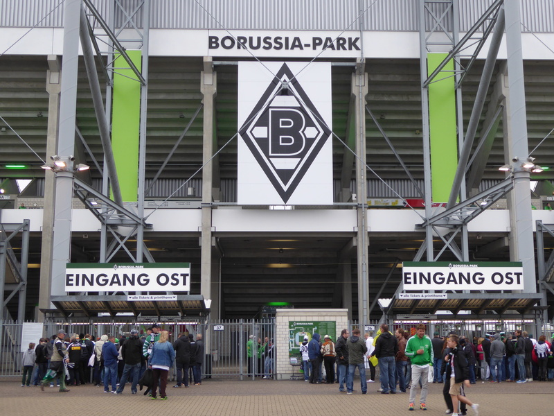 adult, information, western script, mönchengladbach, outdoors, public transportation, group of people, 4K, text, men, stadium, architecture, football