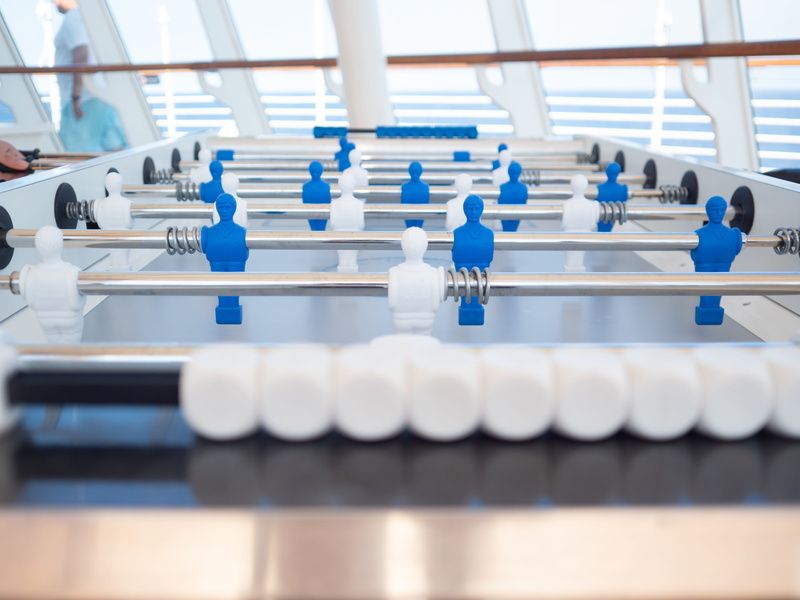 goal, in a row, score, effort, side by side, real people, cooperation, day, recreation, white color, metal, factory, blue, preparation, table, game, teamwork