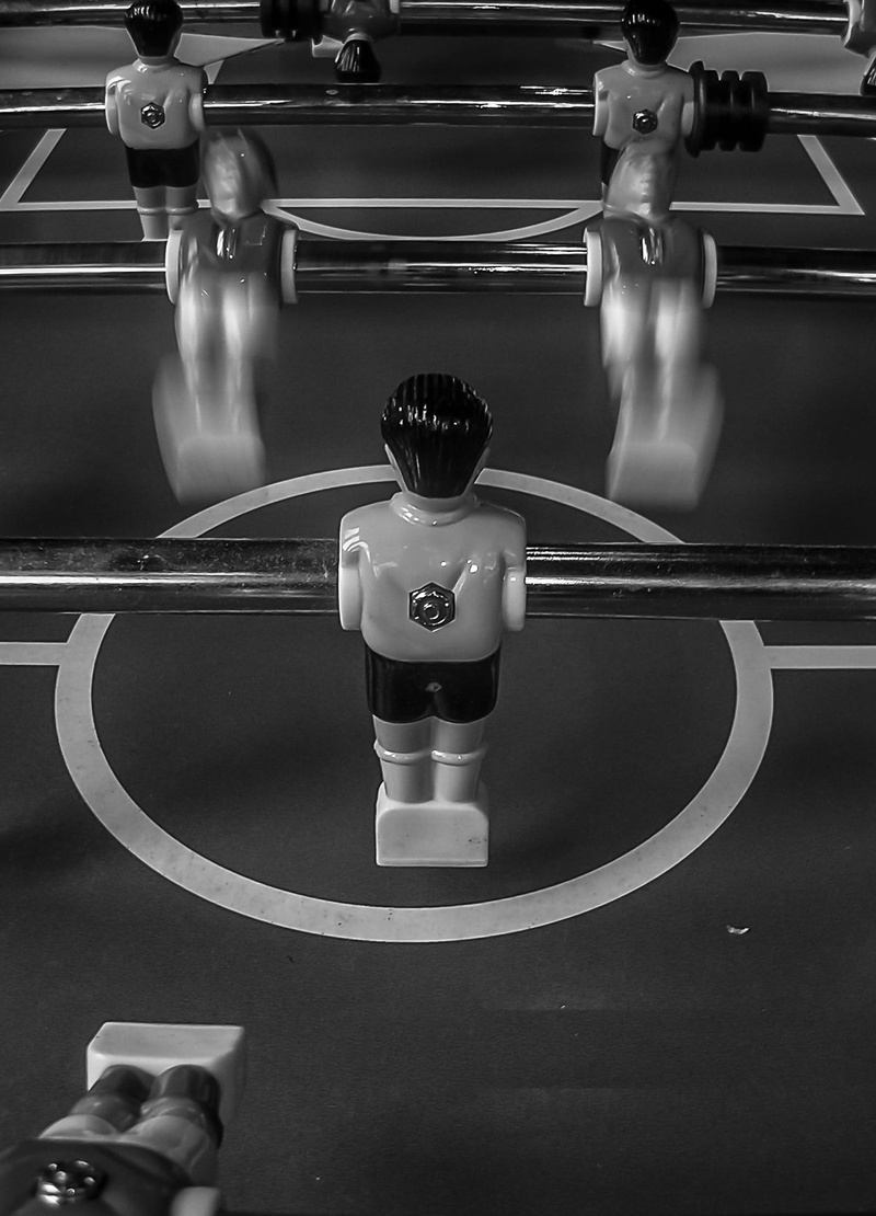 leisure activity, black white, blurred motion, focus on foreground, high angle view, motion, mode of transportation, table football, soccer table, sport
