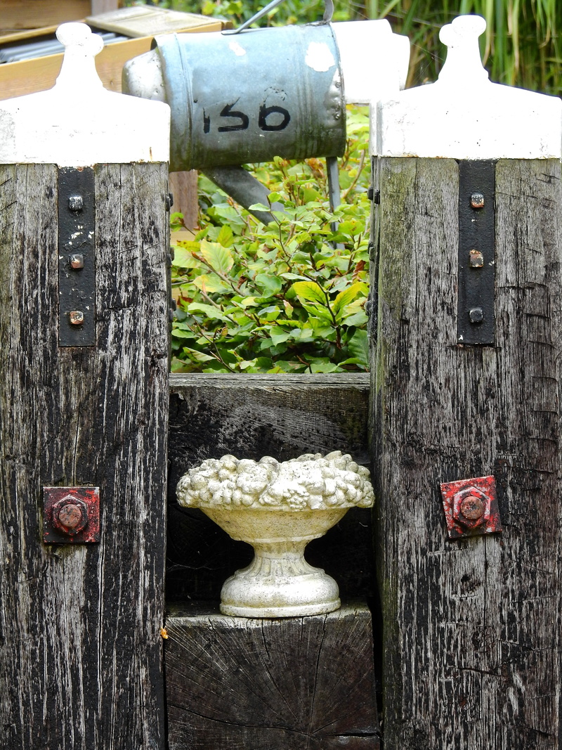 house number, barrier, outdoors, Deco, boundary, number, no people, human representation, decorative, Background, fence, bar, creativity, plant, close-up