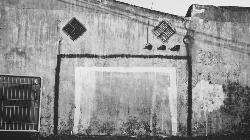 wall, soccer, outdoors, built structure, handpainted, aim, goal post, building, window, low angle view, weathered, abandoned, bad condition, no people