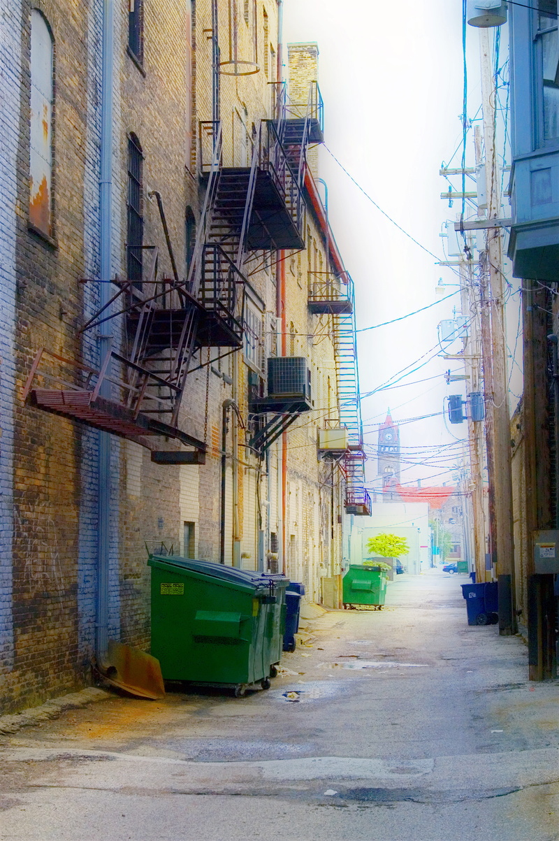 land vehicle, city, transportation, complexity, day, ally, power supply, direction, building, electrical wires, cable, mode of transportation, garbage
