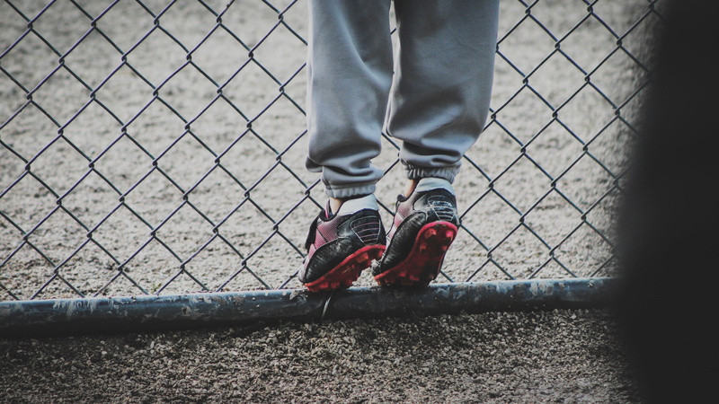 shoe, exercising, sports Shoe, boots, red, jogging, metal, fence, body part, one Person, 5K, human Leg, unrecognizable Person, football, standing, feet