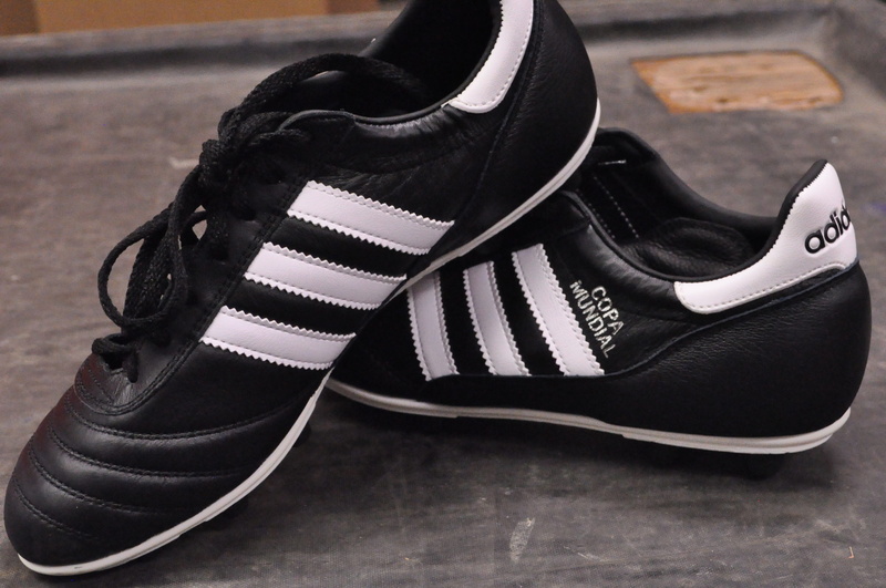 listening, clothing, shoelace, menswear, focus on foreground, black color, no people, still life, adidas, headphones, flooring, soccer cleats, close-up
