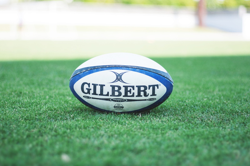 text, focus on foreground, playing field, soccer ball, close-up, number, soccer, sports equipment, selective focus, day, no people, grass, sport, copy space