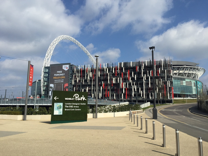water, arena, amusement park, building exterior, amusement park ride, communication, Wembley, arts culture and entertainment, text, outdoors, Arena, nature
