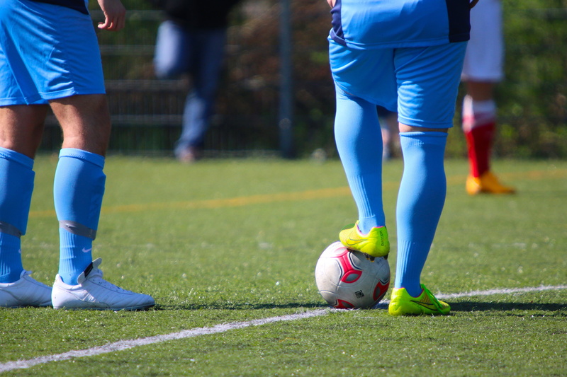 people, human foot, kick-off, soccer ball, human limb, day, ball, team sport, field, athlete, focus on foreground, 5K, man, sports equipment, human body part