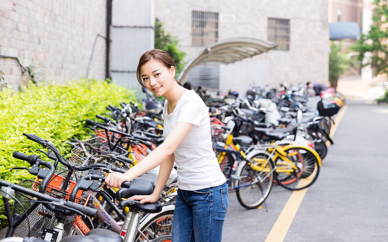 adult, happiness, lifestyles, land vehicle, china, three quarter length, smiling, focus on foreground, building exterior, transportation, riding, city