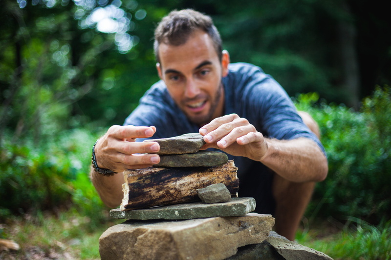 man, piling, hand, wood, young, daytime, zen, meditation, casual clothing, concentration, view, colored, t-shirt, plays, stack, focus on foreground, focus