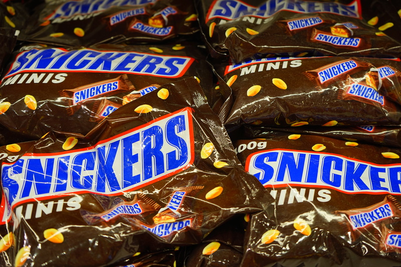 number, full frame, no people, music, mars incorporated, nougat, day, snickers, brown, packs, outdoors, text, sale, food, market, retail, variation, close-up