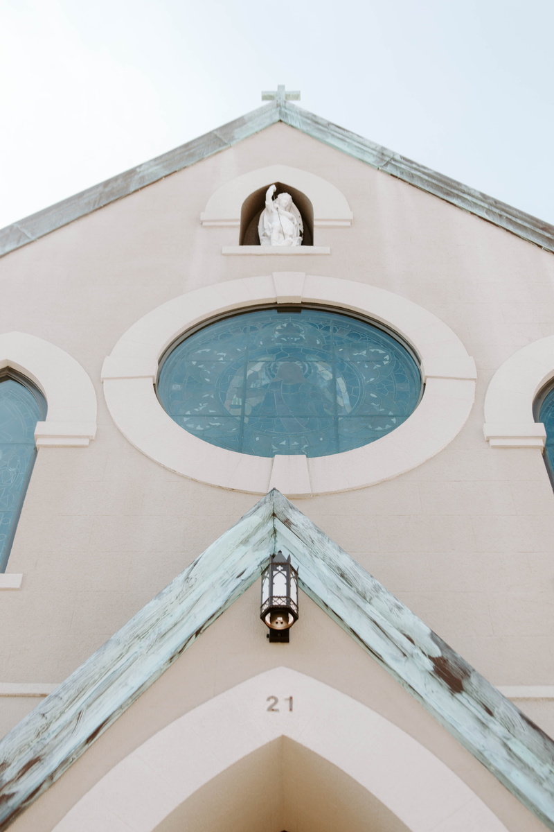 no people, clear sky, spirituality, saint, blue, arch, basilica, belief, tower, outdoors, cathedral, skylight, low angle view, church, grey, lighting equipment