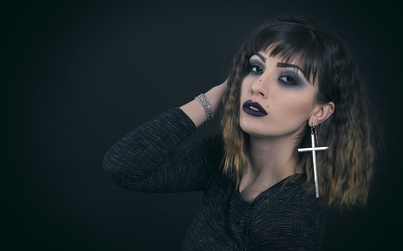 dyed hair, front view, brunette, fashion, adult, looking at camera, portrait, makeup, long hair, one person, hair, studio shot, black background, hairstyle