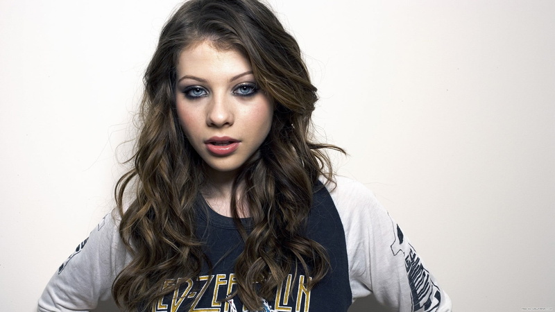 one person, face, hairstyle, beautiful woman, adult, brown hair, headshot, looking at camera, studio shot, leather, Michelle Trachtenberg, front view, long hair