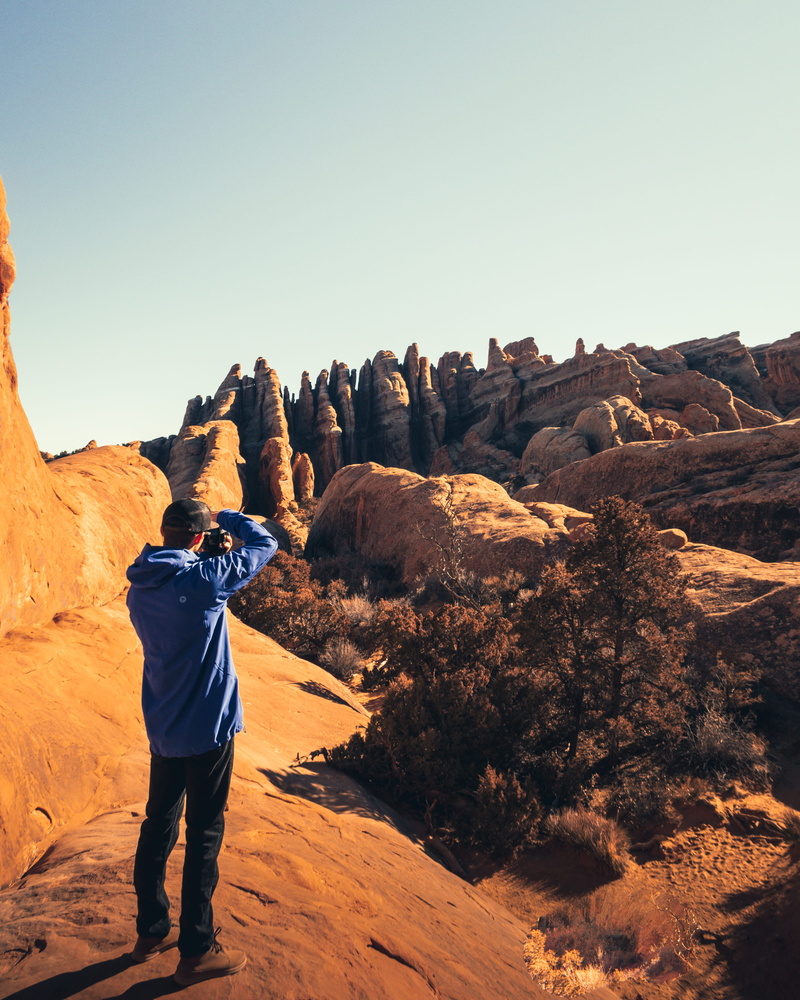 leisure activity, blue, tranquility, hiking, one person, sand, mountain, pictures, soil, activity, solid, beauty in nature, taking, standing, outdoors
